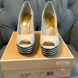 Absolutely beautiful Original Michael Kors, never worn platforms wedges.